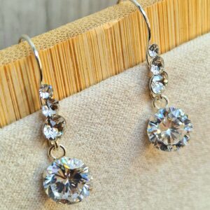 il_fullxfull.5991485772_d7id_4ec4582c-a708-4b54-be37-c0bb091bec9d Silver Drop Dangle Beautiful Shiny CZ Crystal Earrings - This exquisite earring captivates with its timeless elegance.